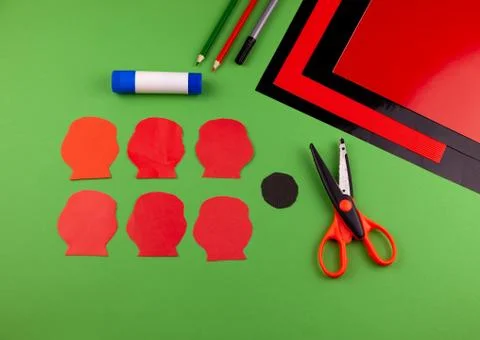 Step 3. Step by step instructions. How to make a red poppy from colored paper Stock Photos