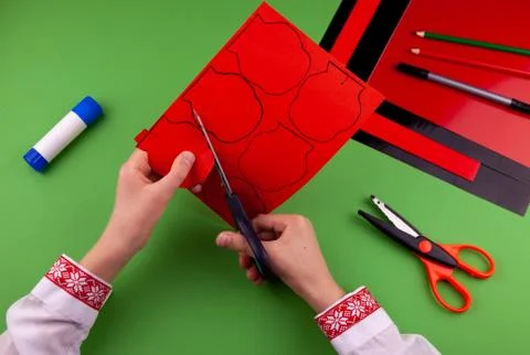 Step 4. Step by step instructions. How to make a red poppy from colored paper Stock Photos