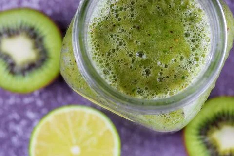 Step 5. Jar a mug with ready-made banana, kiwi and spinach smoothie. Stock Photos