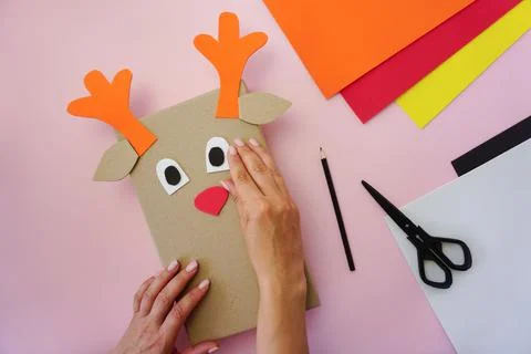 Step 5. Making a gift package in the form of a Christmas deer Stock Photos