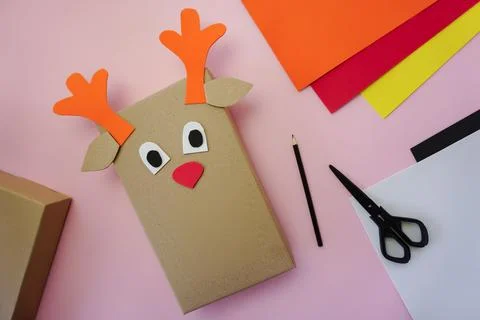 Step 6. Making a gift package in the form of a Christmas deer Stock Photos