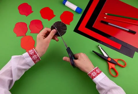 Step 6. Step by step instructions. How to make a red poppy from colored paper Stock Photos