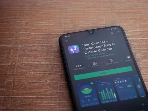 Step Counter app play store page on the display of a black mobile smartphone  Stock Photos
