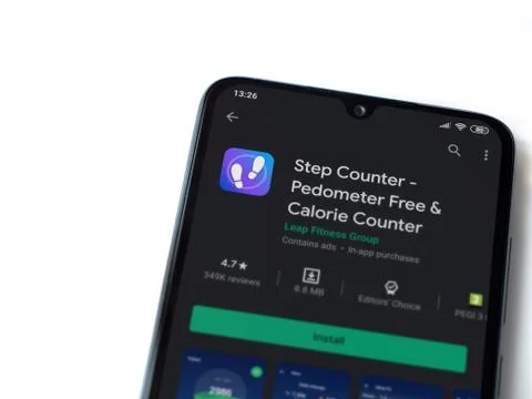 Step Counter app play store page on the display of a black mobile smartphone  Stock Photos