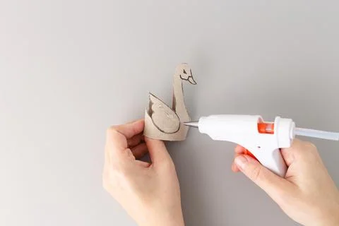 Step in creative process of handmade swan figurine using cardboard and pamp.. Foto stock