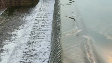Step Dam with Smooth Flow and Frothy Cascade Stock Footage 317174226