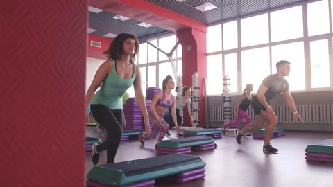 Step group training, smiling people doing exercise Stock-Footage 75870709