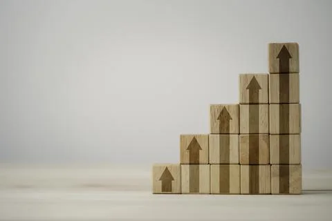 Step of increasing arrow print screen on wooden cube block with copy space Stock Photos