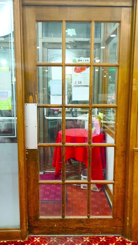 Step Inside for Authentic Cuisine Awaits Behind This Restaurant Door, Peek Stockbeeldmateriaal 318311087