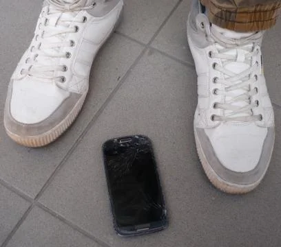 Step on the mobile phone Stock Photos