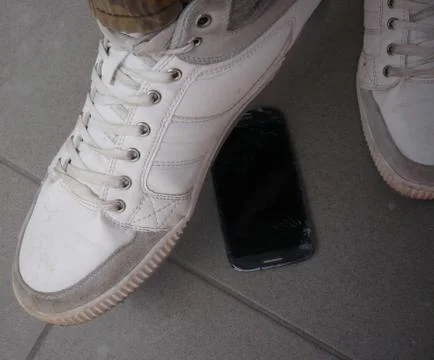 Step on the mobile phone Stock Photos