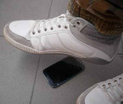 Step on the mobile phone Stock Photos