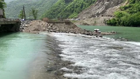 Step on a mountain river, where the flow of water increases Stock Footage 150664462