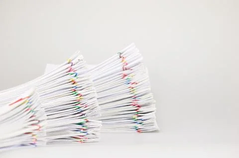Step pile overload paperwork on white table Stock Photos