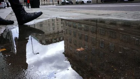 Step on the road into a puddle Stock-Fotos