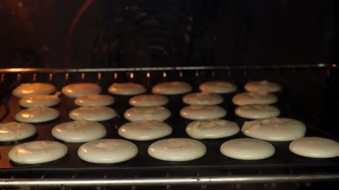 Step by step bake macaron. white airy dough is baked in the oven. Stock Footage 238899767