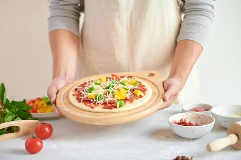 Step-by-step boss makes a pizza margarita. Dough and pizza ingredients Stock Photos