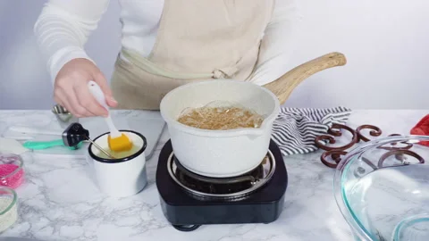 Step by step. Caramelizing sugar in a sm... | Stock Video | Pond5