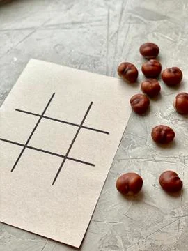 Step by step, children's creativity, game TIC TAC toe of chestnuts. Stock Photos