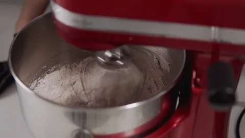 Step by step. Closeup of stand mixer mixing delicious cream to make cake. Stock Footage 108940682
