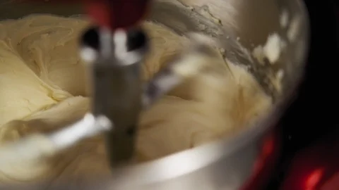 Step by step. Closeup of stand mixer mixing delicious cream to make cake. Video stock 111153315