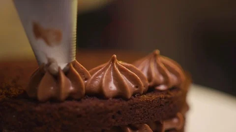 Step by step. The cook collects a chocolate cake with multi-colored Stock Footage 119856945
