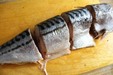 Step-by-step cooking of fish. Cutting mackerel fish. Cut the fish carcass int Stock Photos