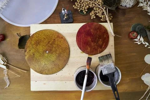 Step-by-step DIY tutorial on making handmade autumn wall clock with natural mate Stock Photos