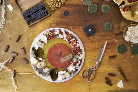 Step-by-step DIY tutorial on making handmade autumn wall clock with natural mate Stock Photos