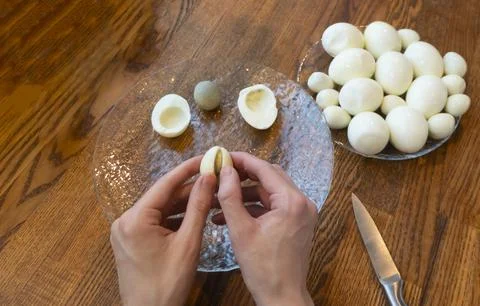 Step by step. egg cut in half, for making stuffed eggs Stock Photos