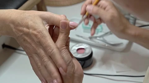 Step by Step French Manicure Tutorial for Mature Hands in a Salon Setting Video stock 323096661