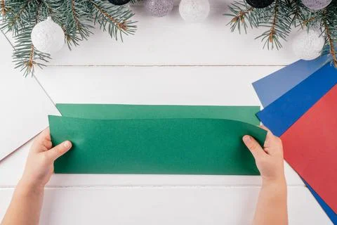 Step-by-step Greeting card 3D Christmas tree tutorial. Step 3: Fold A4 sheet  스톡 사진