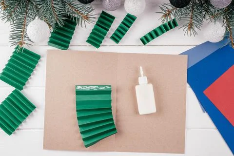 Step-by-step Greeting card 3D Christmas tree tutorial. Step 12: Unfold piece  Stock Photos