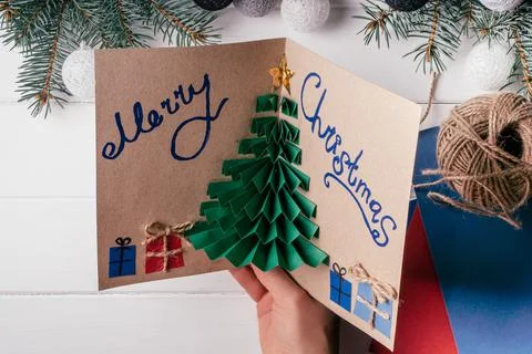 Step-by-step Greeting card 3D Christmas tree tutorial. Step 21: Write somethi 스톡 사진