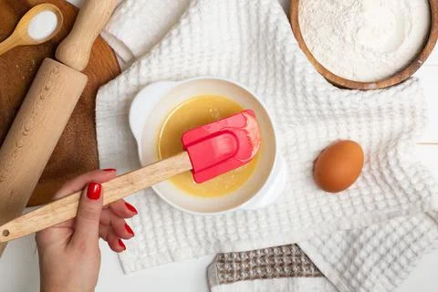 Step-by-step heart-shaped cake recipe instructions. Step 2. Melt butter, suga Stock Photos