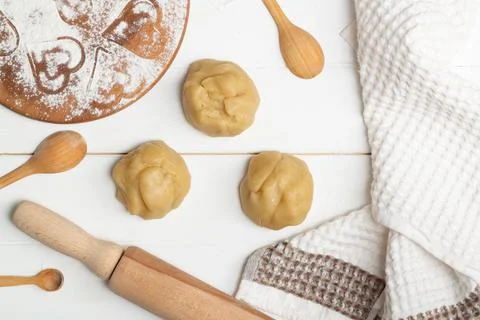 Step-by-step heart-shaped cake recipe instructions. Step 4. Divide the dough  Stock Photos