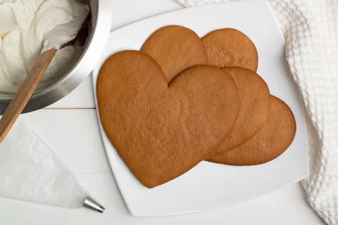 Step-by-step heart-shaped cake recipe instructions. Step 8: Bake the cakes fo Stock Photos