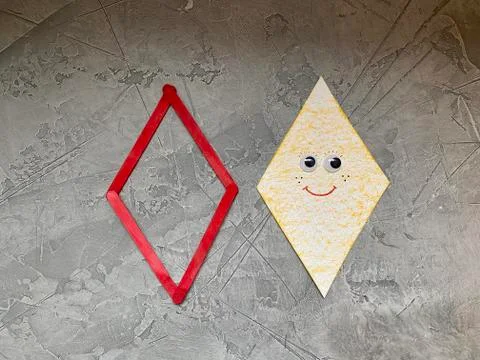 Step by step how to make a flying snake out of paper and ice cream sticks. Stock Photos