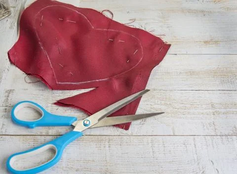Step by step how to make heart from red satin textile. Valentine's day concep Stock Photos