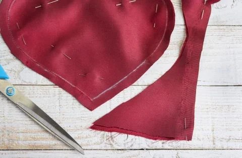 Step by step how to make heart from red satin textile. Valentine's day concep Stock Photos