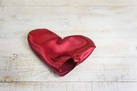 Step by step how to make heart from red satin textile. Valentine's day concep Stock Photos