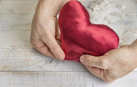 Step by step how to make heart from red satin textile. Valentine's day concep Stock Photos