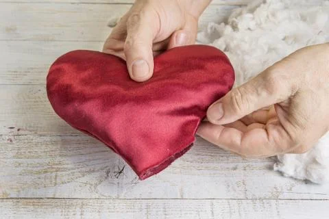 Step by step how to make heart from red satin textile. Valentine's day concep Stock Photos