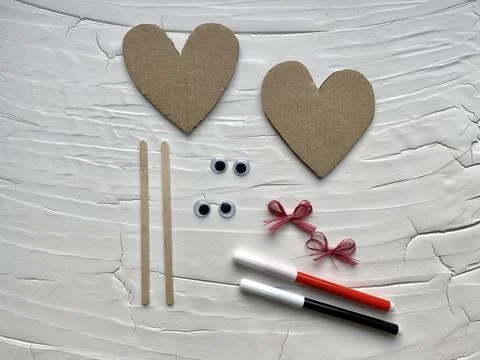 Step by step how to make a heart with eyes from cardboard, kids DIY Stock Photos