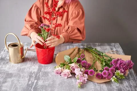 Step by step installation of flowers in a vase. Flowers bunch, set for home Stock Photos