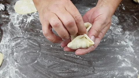 Step-by-step instructions for cooking the national dish manty.manty is a dish Stock Footage 169702202