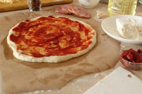 Step-by-step instructions for cooking pizza. Step 1. Roll the dough onto the Stock Photos