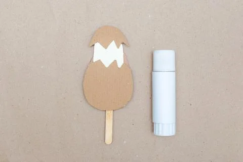 Step-by-step instructions for creating a funny toy Easter egg with cute chicken. Stock Photos