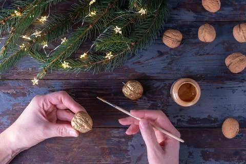 Step-by-step instructions: DIY golden nut tree toy with a metal pendant. St.. Stock Photos