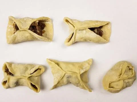 Step-by-step instructions for modeling ravioli with meat. asian cuisine. doug Stock Photos